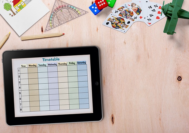 Tablet on a desk with a weekly timetable showing